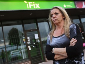 Sandy Rogers is shown in front of the iFix Windsor Ltd. store in Windsor, ON. on Oct. 4, 2017. She brought her daughter's laptop to the store for repairs, but the business has since closed and she has not been able to get it back.