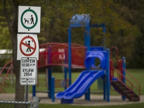 A sign warning dog owners to keep their dogs on a leash is pictured at Paul Wilkinson Park in LaSalle on Oct. 30, 2017.