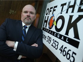 Walter Martin, owner of Off the Hook Paralegal, is pictured at his office on April 17, 2013.