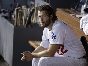 Los Angeles Dodgers starting pitcher Clayton Kershaw sits on the bench after being removed during the seventh inning of Game 1 of the baseball team's National League Division Series against the Arizona Diamondbacks in Los Angeles, on Oct. 6, 2017.