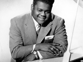 This 1956 photo shows singer, composer and pianist Fats Domino.  The amiable rock 'n' roll pioneer whose steady, pounding piano and easy baritone helped change popular music even as it honoured the grand, good-humoured tradition of the Crescent City, has died. He was 89. Mark Bone, chief investigator with the Jefferson Parish, Louisiana, coroner's office, said Domino died Oct. 24, 2017.