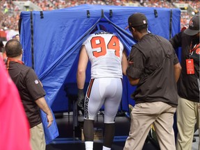 In this Oct. 8, 2017,  photo, Cleveland Browns defensive end Carl Nassib enters a pop-up medical tent on the sideline during an NFL football game against the New York Jets, in Cleveland. This year, the NFL mandated the tents on every sideline at every stadium. They're used mostly for concussion testing or for quick medical work that does not require a trip to the locker room.