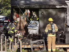 Windsor firefighters are shown in the rear of a fire-damaged home in the 2100 block of Parent Avenue on Oct. 20, 2017.