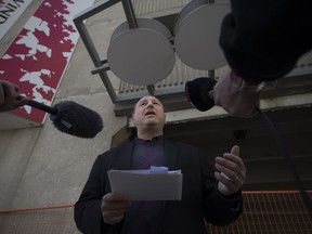 Larry Horwitz, chairman of the Downtown BIA, holds a news conference on Oct. 26, 2017, to announce intentions to file a freedom of Information request on the Pelissier Street parking garage.