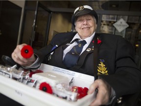 Ruth Lavoie, RCNA, Admiral Hose Branch, pictured in the lobby of the CIBC Building in downtown Windsor, Friday, Oct. 27, 2017, has been handing out poppies for 39 years.