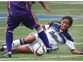 The University of Windsor Lancers' Jade Samping slides on the turf during a 1-1 draw  against the Laurier Golden Hawks on Sunday in OUA women's soccer action at Alumni Field. (DAN JANISSE/The Windsor Star)
Dan Janisse
