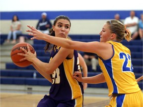 St. Anne's Meg Mooney, right, defends Kingsville's Kiana Buzek during WECSSAA senior girls' basketball action at St. Anne's on Oct. 10, 2017.
