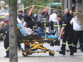 An elderly woman is transported to hospital after being stabbed on Ottawa Street near Hall Avenue in Windsor on Sept. 28, 2016.