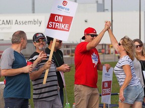 Employees of the GM CAMI assembly factory go back to work Monday night after a month-long strike.