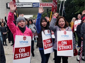 Striking medical lab assistants and technologists, members of Unifor Local 2458, picket outside the Medical Laboratories of Windsor building on Ouellette Avenue on Friday, Oct. 13, 2017.