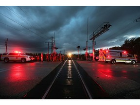 Emergency responders gather after a pedestrian was fatally struck by a freight train in the Lakeshore area on the night of Oct. 4, 2017.