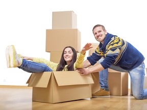 Couple riding in a cardboard box