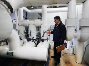 Mark Masanovich, manager of facilities for the Town of LaSalle, is shown in the section of the Vollmer Culture and Recreation Complex where liquid ammonia is pumped through pipes for rink refrigeration.