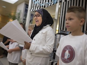 Zoha Awan, 9, left, and Vaughn Truppe, 9, members of the W.E. Care for Kids Hot Chocolate Brigade, speak at a news event at Windsor Regional Hospital Met Campus on  Oct. 18, 2017. The fundraising initiative comes on the heels of this past summer's Lemonade Brigade.