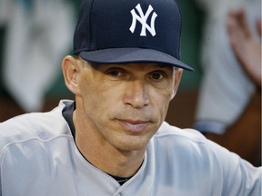 In this July 16, 2017, photo, New York Yankees manager Joe Girardi stands in the dugout before the second game of a baseball doubleheader against the Boston Red Sox, in Boston. The New York Yankees announced Oct. 26, 2017, that Girardi will not return to the team in the 2018 season.