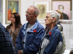 Dementia patient June MaGee, right, with her husband and caregiver Cleveland MaGee make their way through the Art Gallery of Windsor Friday, Nov. 2, 2017, when the couple participated in Remembering Through Art.