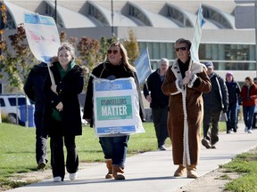 Striking OPSEU members walk the picket line at the St. Clair College Main Campus on Nov. 7, 2017.