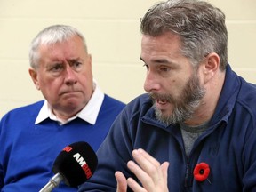 Ontario Council of Hospital Unions president Michael Hurley, left, and Scott Sharp, a personal support worker who was severely injured by a disturbed patient in a Guelph hospital, speak to the media on Nov. 8, 2017.