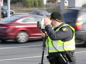 OPP Const. Mike Atkinson targets 
speeding vehicles on Nov. 14, 2017, during a traffic-enforcement patrol on southbound Huron Church Road at Todd Lane. Using a speed laser, he clocked one vehicle doing 90 km/h in a 60 km/h zone. Other OPP cruisers were nearby to help track down offending drivers.