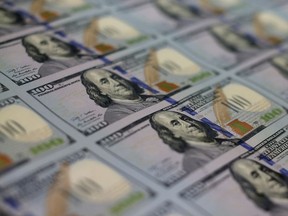 Stacks of US$100 notes are shown at the Bureau of Engraving and Printing on May 20, 2013 in Washington, DC.