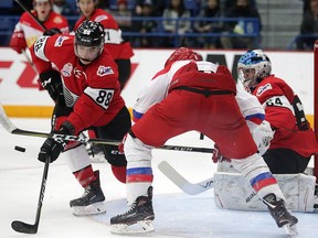 Kevin Bahl of Team OHL tries to clear the loose puck in front OHL goalie Michael DiPietro during the CIBC Canada Russia Series in Sudbury, Ont. on Nov. 13, 2017.