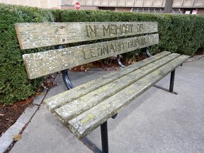 This commemorative bench in South Walkerville near Windsor Regional Hospital's Met campus is covered in lichen and moss.