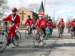 About 20 happy cyclists returned home through Olde Sandwich Towne on Nov. 25, 2017, after having spread Christmas joy and gifts to random strangers on the streets as part of an annual reaching out to those in need.