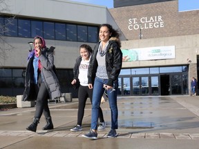 St. Clair College students Saprin Abdelhag, 23, left, Yarabis Munoz, 18, and Lorena Rangel, 18, attended classes at the main campus on Nov. 30, 2017. They are among those who will continue their studies, while another 600 withdrew following a five week faculty strike.