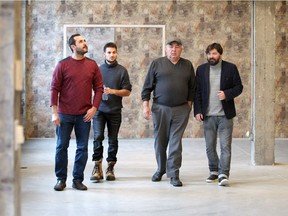 Chris Babic, left, Michael Hoppe, building owner Steve Babic and Accelerator managing director Arthur Barbut, right,  walk through the large main floor at the new home of Windsor Accelerator at 1501 Howard Avenue on Nov. 30, 2017.