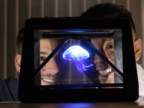 3DFX's Michael Hoppe, left and Janeil Alas unveiled their hologram prototype at the Downtown Windsor  Business Accelerator on Nov. 17, 2017.
