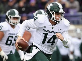Brian Lewerke of the Michigan State Spartans runs for a first down against the Northwestern Wildcats at Ryan Field on Oct. 28, 2017 in Evanston, Ill.