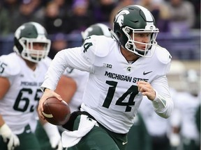 Brian Lewerke of the Michigan State Spartans runs for a first down against the Northwestern Wildcats at Ryan Field on Oct. 28, 2017 in Evanston, Illinois.