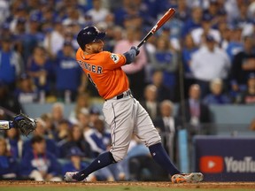 George Springer of the Houston Astros hits a two-run home run during the second inning against the Los Angeles Dodgers in game seven of the 2017 World Series at Dodger Stadium on Nov. 1, 2017 in Los Angeles.