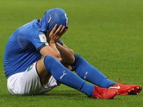 Alessandro Florenzi of Italy reacts after the FIFA 2018 World Cup qualifier between Italy and Sweden at San Siro Stadium in Milan on Nov. 13, 2017.