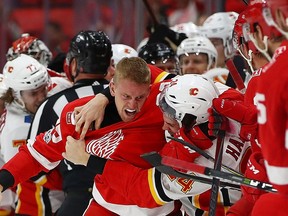 Anthony Mantha of the Detroit Red Wings gets in a fight with Travis Hamonic of the Calgary Flames during the third period at Little Caesars Arena on Nov. 15, 2017, in Detroit, Mich. Detroit won the game 8-2.