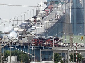 Traffic, including tractor trailers, move off the Ambassador Bridge and into the customs plaza in WIndsor.