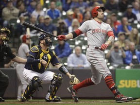 Cincinnati Reds' Joey Votto hits a home run during the first inning of a baseball game against the Milwaukee Brewers in Milwaukee on September 27, 2017. When Canada's Joey Votto heard that he had narrowly lost out on the National League MVP award, the Cincinnati Reds star was more shocked than disappointed. Not shocked at losing. Shocked at how close the vote was.