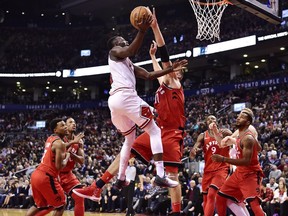 Chicago Bulls guard Jerian Grant (2) is blocked by Toronto Raptors centre Jonas Valanciunas (17) during the second half of an NBA game in Toronto on Nov. 7, 2017.