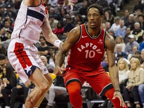 Toronto Raptors guard DeMar DeRozan dribbles toward the hoop against the Washington Wizards on Nov. 19, 2017, in Toronto.