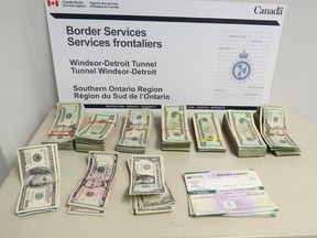 $26,588 U.S. cash in small bills that was seized by the CBSA on the Canadian side of the Detroit-Windsor Tunnel on Nov. 18, 2017.