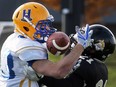 Jason Price of the Saskatoon Hilltops, left, hauls in a pass while fighting off Jalen Butcher of the Windsor AKO Fratmen on Nov. 11, 2017, during the 110th Canadian Bowl at the University of Windsor Alumni field against the Windsor AKO Fratmen.