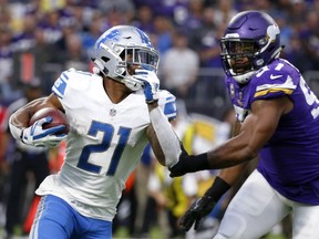 In this Oct. 1, 2017, photo, Detroit Lions running back Ameer Abdullah, left, runs from Minnesota Vikings defensive end Everson Griffen during the first half of an NFL football game in Minneapolis.