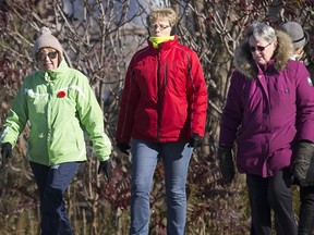 A group of women walk along the waterfront dressed in their winter gear Friday on a record-cold Windsor November 10.