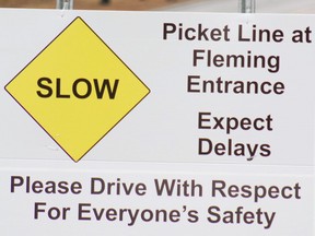 A sign is seen on the picket line at Fleming College in Peterborough on Nov. 13, 2017.