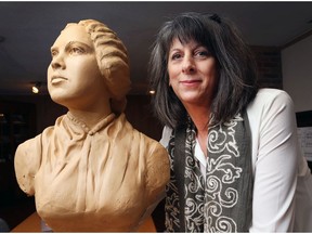 Donna Jean Mayne poses with a study of Mary Ann Shadd that she sculpted recently. Mayne wants to produce a full-sized bronze statue of the famous anti-slavery activist.