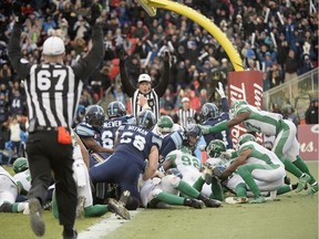 Toronto Argonauts quarterback Cody Fajardo (17) breaks the plane for a touchdown during second half CFL East Division final football action against the Saskatchewan Roughriders at BMO Field in Toronto on Nov.19, 2017.
