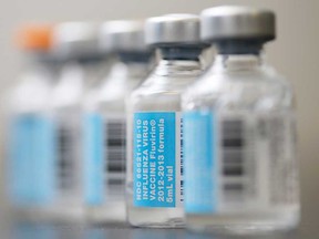 Vials of flu vaccine are shown in this 2013 file photo.