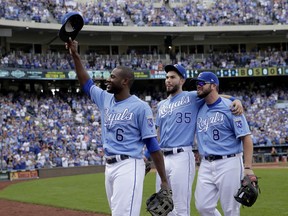 In this Sunday, Oct. 1, 2017, photo, veteran Kansas City Royals players Lorenzo Cain (6), Eric Hosmer (35) and Mike Moustakas (8) acknowledge the crowd as they come out of the game during the fifth inning of a baseball game against the Arizona Diamondbacks in Kansas City, Mo. Kansas City Royals first baseman Eric Hosmer, third baseman Mike Moustakas and outfielder Lorenzo Cain were among nine free agents who have received $17.4 million qualifying offers from their teams on Nov. 6, 2017.