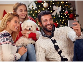 A family takes a Christmas self-portrait.