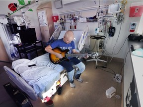 Justin Jewell is shown in his hospital room at the Children's Hospital at London Health Sciences Centre, in London on Oct. 26, 2017. The Lakeshore, ON. teenager is using his musical talents to cope with his cancer treatments and has become a source of comfort and diversion for other kids with cancer at the hospital.